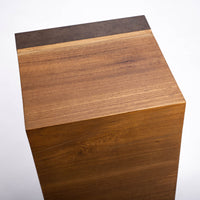 Kobe Low cuboid side table with wooden look made from ollection of organic designed metal and “Toasted Yukas” wood species from South America. Closed up top view.