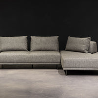 Grey fabric Felix Sectional with moveable back and arm rests and metal legs.