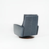 A blue Lanier leather recliner chair with the shape of classic automotive designs, back view.