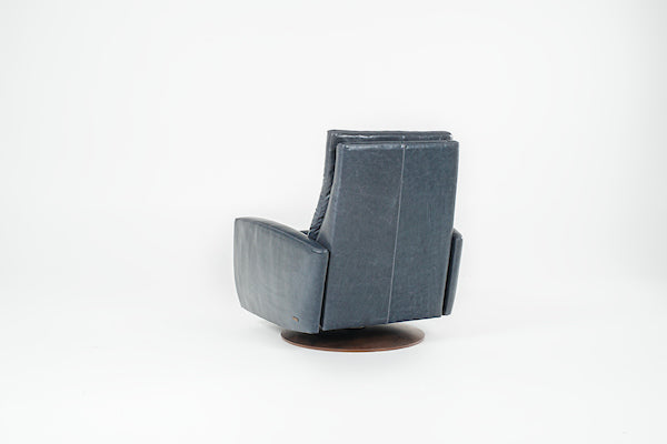 A blue Lanier leather recliner chair with the shape of classic automotive designs, back view.