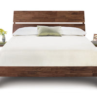 Linn queen size bed crafted from reclaimed walnut hardwood with contemporary design, front view, with bedside tables.