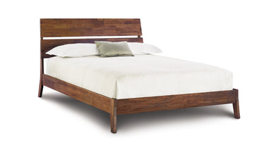 Linn queen size bed crafted from reclaimed walnut hardwood with contemporary design.