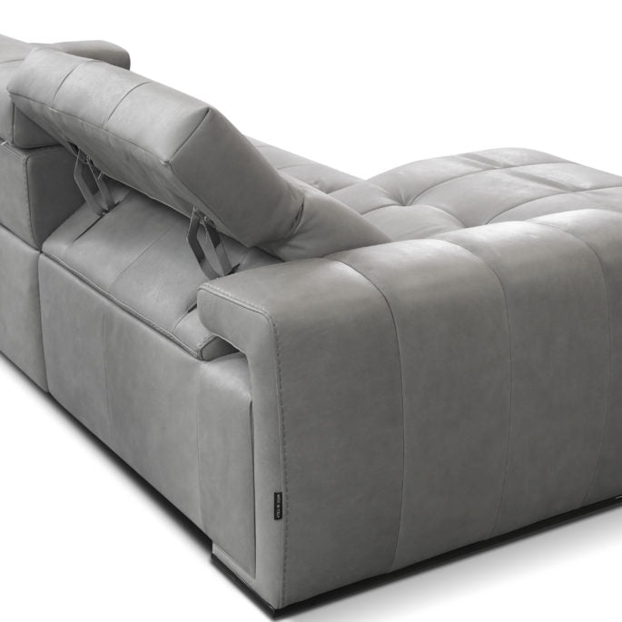 Grey leather 3 seater sofa consisting of 1 left arm, 1 right arm, and 1 armless chair with electric head and footrest. Back view.