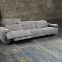Grey leather 3 seater sofa consisting of 1 left arm, 1 right arm, and 1 armless chair with electric head and footrest. Left side reclined. Placed in a room.