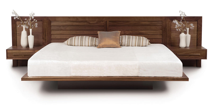 King size Moduluxe bed with modular headboard and nightstands with a floating look in wood colors.