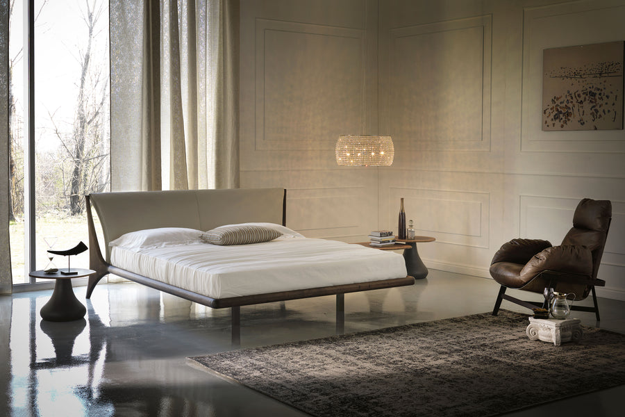 The Nelson designer modern king size bed with a light shape, placed in a modern room, front and side view.