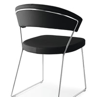 A black leather New York Dining Chair with metal frame and sled base and curved back. Back and side view.