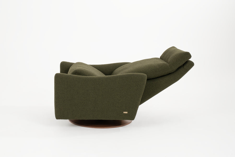 A green fabric Ontario modern rocking recliner chair, side view, reclined.