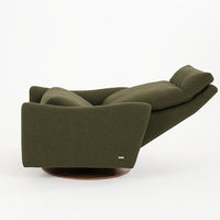 A green fabric Ontario modern rocking recliner chair, side view, reclined.