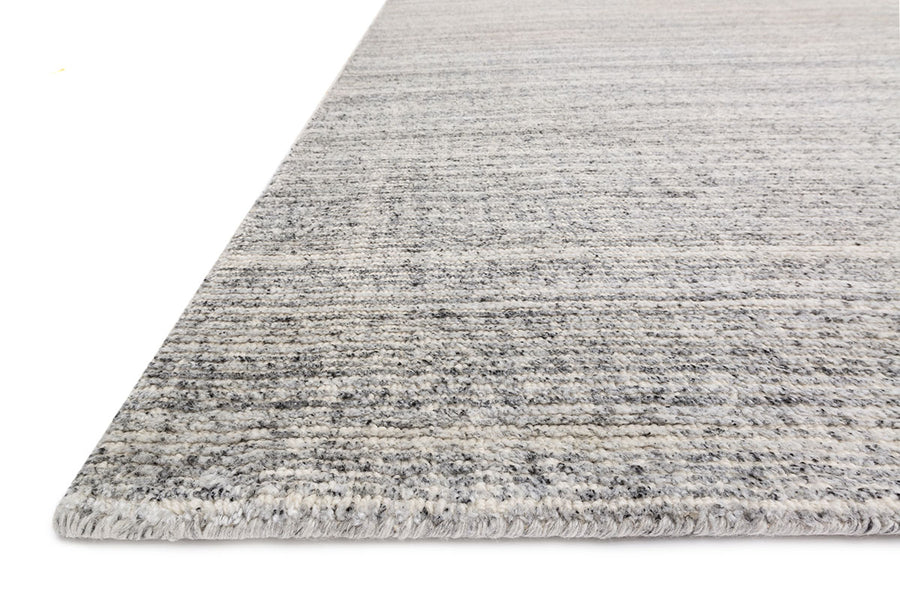 Hand loom knotted Porter Charcoal Area Rug with natural striations of viscose, wool, and polyester.