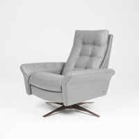 A grey leather recliner chair with buttonless tufted back and seat and four star base.