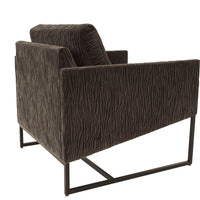 A brown Rebel lounge chair with angled side profile and metal frame, side and back view.