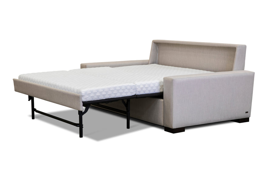 American Leather Rogue Two Seat Comfort Sofa bed in light colors, front and side view, pulled-out.