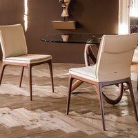 Three White Sofia Dining side chairs with wooden base. Placed in a dining room.