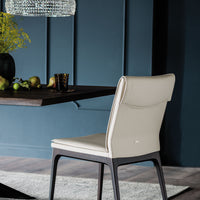 White Sofia Dining side chair with wooden base. 