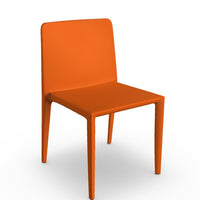 Molded polyurethane wrapped orange dining chair.