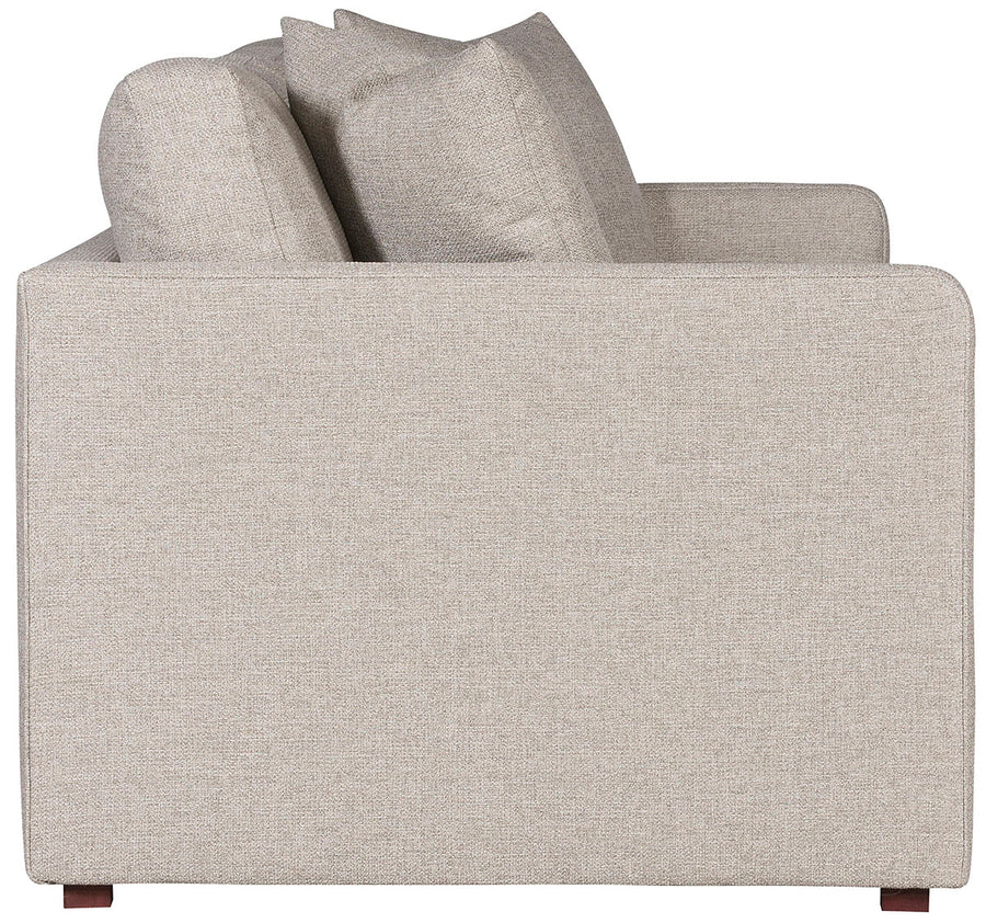 Light grey two seat Wynne Stocked Sofa with curved back and front and single seat cushion and 2 back pillows. Side view.