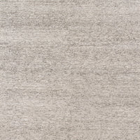 Hand loom knotted Valor Ivory/Natural Area Rug with patternless designs that are crafted of wool, viscose, and lyocell, featuring subtle and natural striations throughout the pieces.