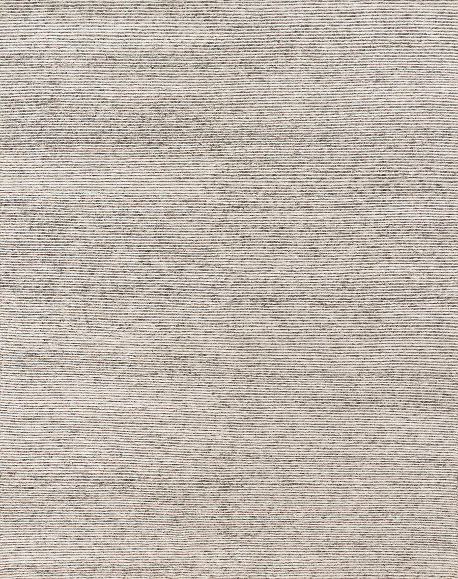 Hand loom knotted Valor Ivory/Natural Area Rug with patternless designs that are crafted of wool, viscose, and lyocell, featuring subtle and natural striations throughout the pieces.