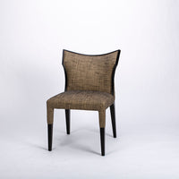 Villa side dining chair with solid beech wood frame that twists and curves to form the lines of the chair.