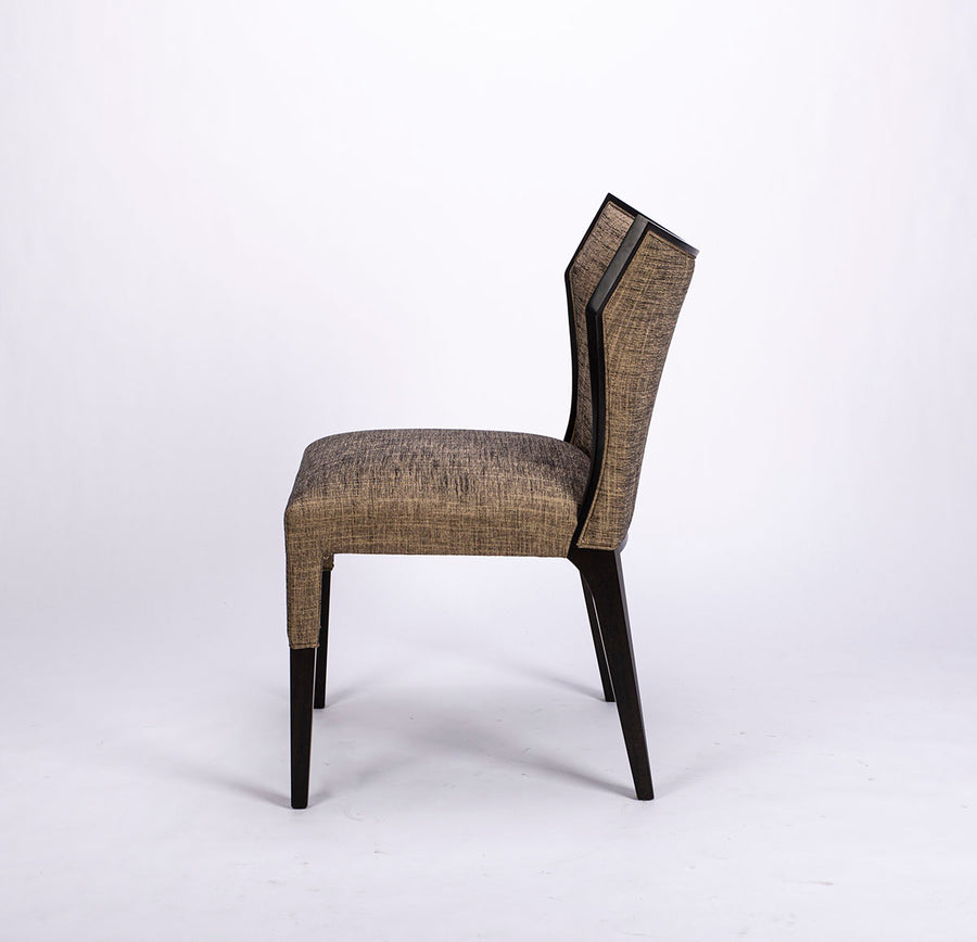 Villa side dining chair with solid beech wood frame that twists and curves to form the lines of the chair, side view.