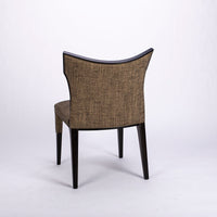 Villa side dining chair with solid beech wood frame that twists and curves to form the lines of the chair, side and back view.