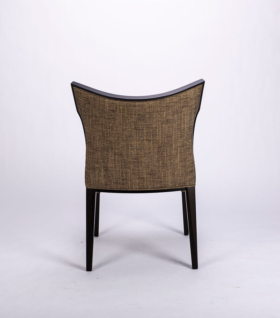 Villa side dining chair with solid beech wood frame that twists and curves to form the lines of the chair, back view.