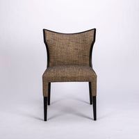 Villa side dining chair with solid beech wood frame that twists and curves to form the lines of the chair, front view.