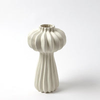 White, hand-crafted Lithos Vase with irregular ridges that accentuate the three organic shapes.