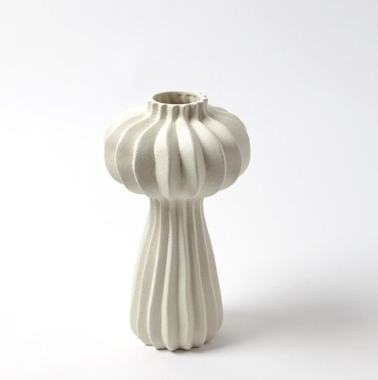 White, hand-crafted Lithos Vase with irregular ridges that accentuate the three organic shapes.