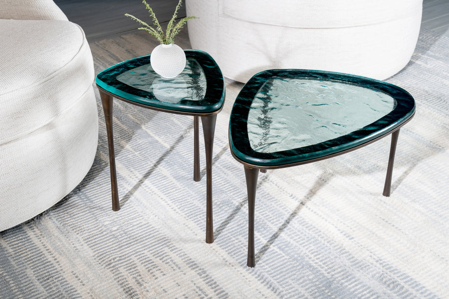 Reuleaux small Cocktail Table with rounded, asymmetrical green glass top and elegantly tapered legs.