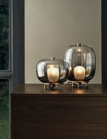 Two different size orb shaped Blow laps with elements of borosilicate glass, natural brass frame and ceiling rose.