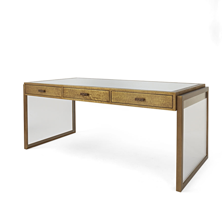 Brooklyn Desk finished in shagreen metal, supported by brass wrapped rectangular legs, and with three drawers. Front and side view.