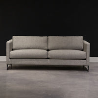 Grey two seat Benedict sofa with clean lines and sleek metal legs. Front view.