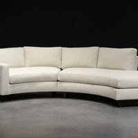 White curved Clip Sectional with the wood legs. Front view.