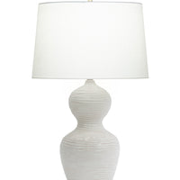Eloise Table Lamp with white shade, a curved silhouette body in natural ceramic, and the base that has a distinctive textured finish in both off-white and beige hues.