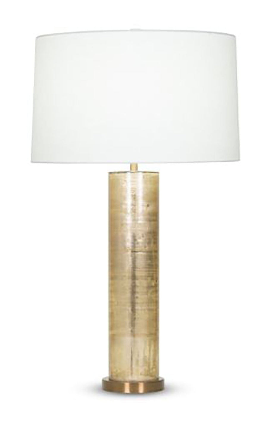 Melville Table Lamp with white drum shade, antique brass finished base and tall column body  handmade of mouth-blown glass with a Gold Metallic finish.