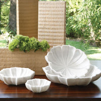 Marble Petal four Bowl Collection formed in snow white honed marble and pieces carved into petal-like shapes.