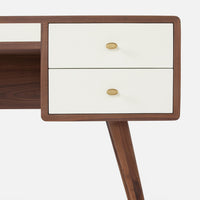 Delmira Desk with four drawers covered in dove white faux canvas and spacious top, cabinet, and angled tapered legs, all hand-crafted from the highest quality stained walnut. Closed up view of the left side.