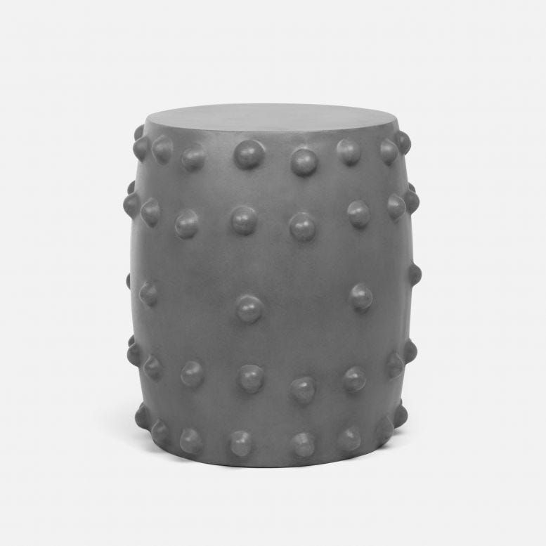 Grey reinforced concrete side table, barrel shaped with exaggerated round rive detail.