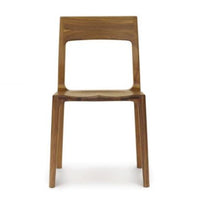 Lisse dining chair crafted in solid American black walnut hardwood and Made to Order in natural finish. Front view.