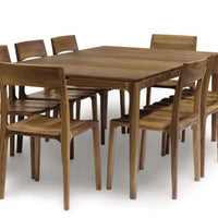 Lisse Extension dining table crafted in solid American black walnut hardwood with natural finish and with a single self-storing butterfly leaf for single handed operation. Shown with eight matching chairs around it.