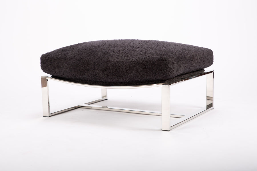 Dark grey ottoman with a brushed bronze frame combined with the luxurious seat.