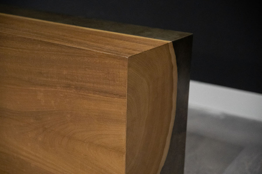 Yuka wood Kobe console with the anodized metal panels and toasted finish, closed up view.