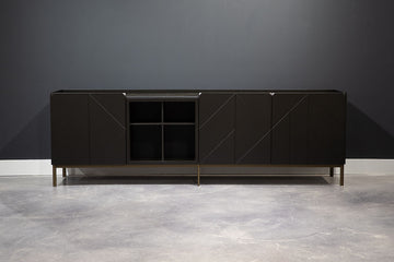 Brown Pica Cabinet adorned with wooden sideboards & hinged doors with ide panels and doors designed in lacquered decorated wood.