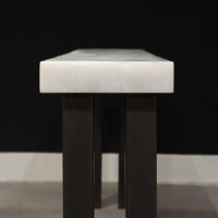 Modern console table with white top and black legs, side view.
