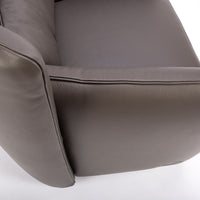 Dark brown leather Tulip swivel armchair, endowed with a lower-back cushion. Closed up top side view.