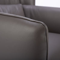 Dark brown leather Tulip swivel armchair, endowed with a lower-back cushion. Closed up side view.