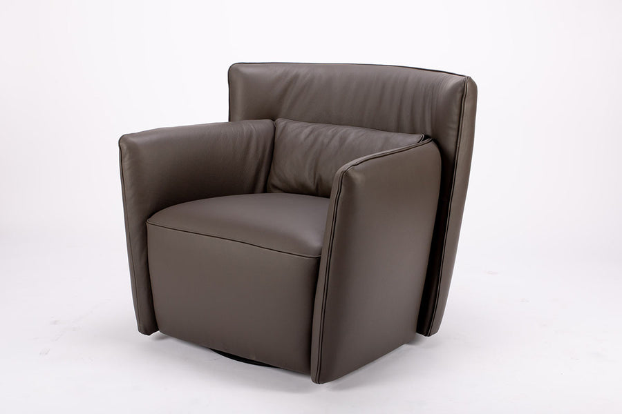 Dark brown leather Tulip swivel armchair, endowed with a lower-back cushion. Side view.