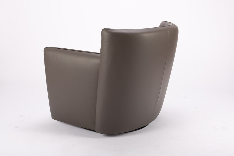 Dark brown leather Tulip swivel armchair, endowed with a lower-back cushion. Side and back view.